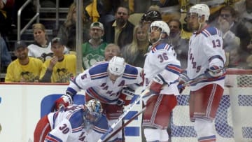 Apr 13, 2016; Pittsburgh, PA, USA; New York Rangers goalie Henrik Lundqvist (30) is attended to by defenseman Dan Girardi (5) after suffering an apparent injury against the Pittsburgh Penguins during the first period in game one of the first round of the 2016 Stanley Cup Playoffs at the CONSOL Energy Center. Mandatory Credit: Charles LeClaire-USA TODAY Sports