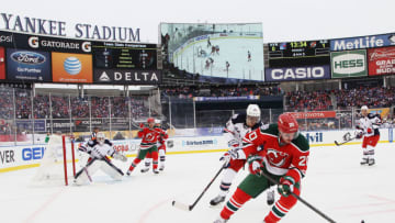 NEW YORK, NY - JANUARY 26: (EDITORIAL USE ONLY) Ryan Carter #20 of the New Jersey Devils controls the puck against the New York Rangers during the 2014 Coors Light NHL Stadium Series at Yankee Stadium on January 26, 2014 in the Bronx borough of New York City. (Photo by Bruce Bennett/Getty Images)