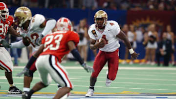 NEW ORLEANS - JANUARY 1: Wide Receiver Anquan Boldin #4 of the Florida State University Seminoles carries the ball during the Nokia Sugar Bowl against the University of Georgia Bulldogs at the Louisiana Superdome on January 1, 2003 in New Orleans, Louisiana. Georgia defeated Florida State 26-13. (Photo by Matthew Stockman/Getty Images)