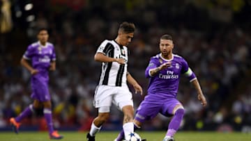 CARDIFF, WALES - JUNE 03: Paulo Dybala of Juventus and Sergio Ramos of Real Madrid battle for possession during the UEFA Champions League Final between Juventus and Real Madrid at National Stadium of Wales on June 3, 2017 in Cardiff, Wales. (Photo by David Ramos/Getty Images)