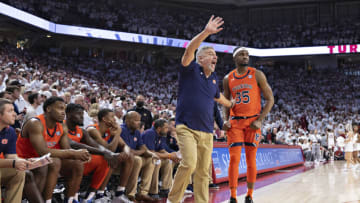 FAYETTEVILLE, ARKANSAS - FEBRUARY 08: Head Coach Bruce Pearl subs in Devan Cambridge #35 of the Auburn Tigers during a game against the Arkansas Razorbacks at Bud Walton Arena on February 08, 2022 in Fayetteville, Arkansas. The Razorbacks defeated the Tigers 80-76. (Photo by Wesley Hitt/Getty Images)