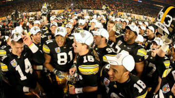 MIAMI GARDENS, FL - JANUARY 05: Tony Moeaki #81 of the Iowa Hawkeyes celebrates with his teammates after Iowa won 24-14 against the Georgia Tech Yellow Jackets during the FedEx Orange Bowl at Land Shark Stadium on January 5, 2010 in Miami Gardens, Florida. (Photo by Streeter Lecka/Getty Images)