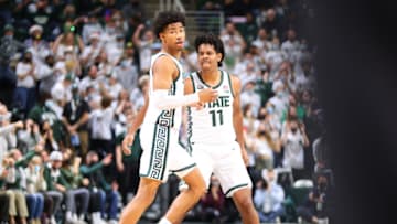 EAST LANSING, MI - DECEMBER 11: Jaden Akins #3 and A.J. Hoggard #11 of the Michigan State Spartans celebrate in the first half of the game against the Penn State Nittany Lions at Breslin Center on December 11, 2021 in East Lansing, Michigan. (Photo by Rey Del Rio/Getty Images)
