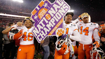 TAMPA, FL - JANUARY 09: (L-R) Linebacker Jarvis Magwood #46, safety Isaiah Simmons #11 and wide receiver Diondre Overton #14 of the Clemson Tigers celebrate after defeating the Alabama Crimson Tide 35-31 to win the 2017 College Football Playoff National Championship Game at Raymond James Stadium on January 9, 2017 in Tampa, Florida. (Photo by Jamie Squire/Getty Images)