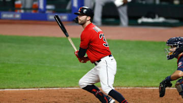 CLEVELAND, OH - AUGUST 26: Tyler Naquin #30 of the Cleveland Indians hits a one run double off relief pitcher Sergio Romo #54 of the Minnesota Twins during the eighth inning at Progressive Field on August 26, 2020 in Cleveland, Ohio. The Indians defeated the Twins 6-3. (Photo by Ron Schwane/Getty Images)