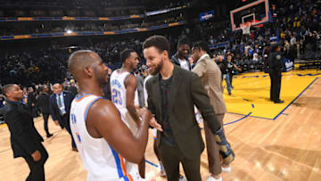Chris Paul #3 of the OKC Thunder and Stephen Curry #30 of the Golden State Warriors hi-five after a game on November 25, (Photo by Noah Graham/NBAE via Getty Images)