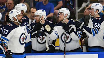 ST. LOUIS, MO - APRIL 20: Winnipeg Jets defenseman Dustin Byfuglien (33) is congratulated by teammates after scoring in the third period during a first round Stanley Cup Playoffs game between the Winnipeg Jets and the St. Louis Blues, on April 20, 2019, at Enterprise Center, St. Louis, Mo. (Photo by Keith Gillett/Icon Sportswire via Getty Images)