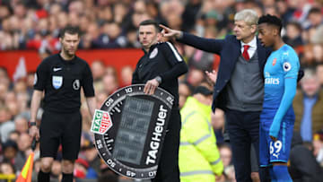 MANCHESTER, ENGLAND - APRIL 29: Arsene Wenger, Manager of Arsenal speaks with Joseph Willock of Arsenal prior to being subtituted on during the Premier League match between Manchester United and Arsenal at Old Trafford on April 29, 2018 in Manchester, England. (Photo by Shaun Botterill/Getty Images)