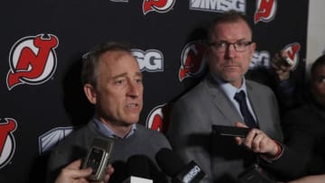 NEWARK, NEW JERSEY - JANUARY 12: New Jersey Devils owner Joshua Harris (L) answers questions from the media after announcing that Tom Fitzgerald (R) has taken over general manager duties prior to a game against the Tampa Bay Lightning at Prudential Center on January 12, 2020 in Newark, New Jersey. The team relieved former general manager Ray Shero earlier in the day. (Photo by Jim McIsaac/Getty Images)