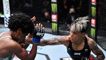 LAS VEGAS, NEVADA - DECEMBER 18: (R-L) Amanda Lemos of Brazil punches Angela Hill in their bantamweight fight during the UFC Fight Night event at UFC APEX on December 18, 2021 in Las Vegas, Nevada. (Photo by Jeff Bottari/Zuffa LLC)