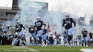 Nov 6, 2021; Chapel Hill, North Carolina, USA; North Carolina Tar Heels run on to the field before the game at Kenan Memorial Stadium. Mandatory Credit: Bob Donnan-USA TODAY Sports