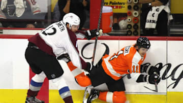 PHILADELPHIA, PENNSYLVANIA - OCTOBER 22: Patrik Nemeth #12 of the Colorado Avalanche hits Travis Konecny #11 of the Philadelphia Flyers during the third period at the Wells Fargo Center on October 22, 2018 in Philadelphia, Pennsylvania. The Avalanche defeated the Flyers 4-1. (Photo by Bruce Bennett/Getty Images)