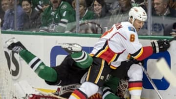 Jan 25, 2016; Dallas, TX, USA; Dallas Stars center Mattias Janmark (13) fights for the puck with Calgary Flames defenseman Dennis Wideman (6) and goalie Karri Ramo (31) during the second period at the American Airlines Center. Mandatory Credit: Jerome Miron-USA TODAY Sports