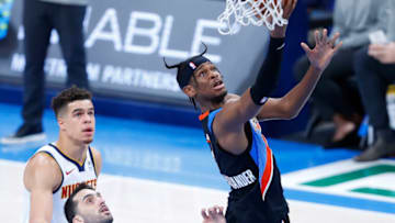 OKC Thunder guard Shai Gilgeous-Alexander (2) goes to the basket vs. Nuggets forward Michael Porter Jr. (1) : Alonzo Adams-USA TODAY Sports