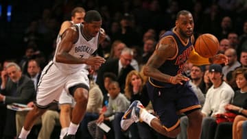 Mar 27, 2015; Brooklyn, NY, USA; Cleveland Cavaliers forward LeBron James (23) brings the ball up court defended by Brooklyn Nets forward Joe Johnson (7) during the first half at Barclays Center. Mandatory Credit: Adam Hunger-USA TODAY Sports