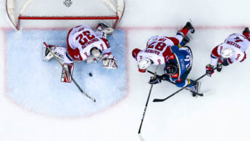 SOCHI, RUSSIA - FEBRUARY 3, 2019: Lokomotiv Yaroslavl's goalie Ilya Konovalov, Lokomotiv Yaroslav's Rushan Rafikov, HC Sochi's Artyom Tomilin and Lokomotiv Yaroslavl's Alexander Yelesin (L-R) in their 2018/2019 KHL Regular Season ice hockey match at Bolshoy Ice Dome. HC Lokomotiv Yaroslav won the game 4-3. Dmitry Feoktistov/TASS (Photo by Dmitry FeoktistovTASS via Getty Images)