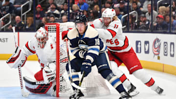COLUMBUS, OH - OCTOBER 24: Pierre-Luc Dubois #18 of the Columbus Blue Jackets shields the puck from Jordan Staal #11 of the Carolina Hurricanes as goaltender Petr Mrazek #34 of the Carolina Hurricanes defends the net during the first period of a game on October 24, 2019 at Nationwide Arena in Columbus, Ohio. (Photo by Jamie Sabau/NHLI via Getty Images)