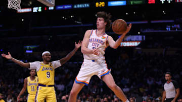 Josh Giddey #3 of the Oklahoma City Thunder makes a play on the rebound in front of Kent Bazemore #9 of the Los Angeles Lakers during the first half at Staples Center on November 04, 2021 in Los Angeles, California. (Photo by Harry How/Getty Images)
