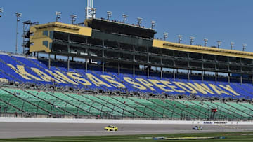 May 6, 2016; Kansas City, KS, USA; NASCAR Sprint Cup Series driver Matt Kenseth (20) and Jimmie Johnson (48) during practice of the GoBowling 400 at Kansas Speedway. Mandatory Credit: Jasen Vinlove-USA TODAY Sports