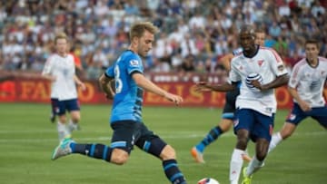 Jul 29, 2015; Denver, CO, USA; Tottenham Hotspur midfielder Christian Eriksen (23) kicks the ball against MLS All Stars defender DeMarcus Beasley (16) of the Houston Dynamo during the first half of the 2015 MLS All Star Game at Dick