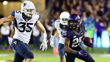 Oct 29, 2015; Fort Worth, TX, USA; TCU Horned Frogs wide receiver KaVontae Turpin (25) carries the ball as West Virginia Mountaineers linebacker Nick Kwiatkoski (35) chases during the first quarter of a game at Amon G. Carter Stadium. Mandatory Credit: Ray Carlin-USA TODAY Sports
