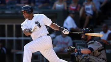 Aug 31, 2014; Chicago, IL, USA; Chicago White Sox right fielder Dayan Viciedo hits a single against the Detroit Tigers during the seventh inning at U.S Cellular Field. Mandatory Credit: Jerry Lai-USA TODAY Sports