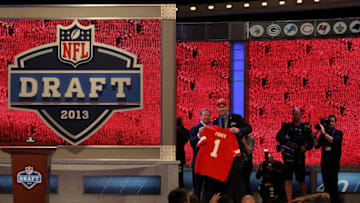 NEW YORK, NY - APRIL 25: Eric Fisher (R) of Central Michigan Chippewas stands on stage with NFL COmmissioner Roger Goodell after Fisher was picked #1 overall by the Kansas City Chiefs in the first round of the 2013 NFL Draft at Radio City Music Hall on April 25, 2013 in New York City. (Photo by Chris Chambers/Getty Images)