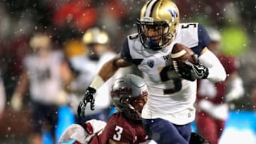 PULLMAN, WA - NOVEMBER 23: Andre Baccellia #5 of the Washington Huskies carries the ball against Darrien Molton #3 of the Washington State Cougars in the first half at Martin Stadium during the 111th Apple Cup on November 23, 2018 in Pullman, Washington. (Photo by William Mancebo/Getty Images)