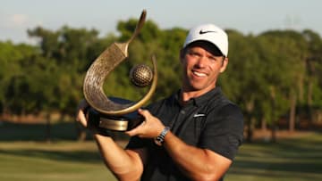 PALM HARBOR, FLORIDA - MARCH 24: Paul Casey of England celebrates with the winner's trophy after the final round of the Valspar Championship on the Copperhead course at Innisbrook Golf Resort on March 24, 2019 in Palm Harbor, Florida. (Photo by Matt Sullivan/Getty Images)