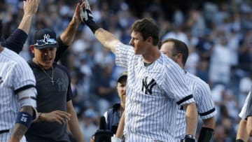 NEW YORK, NEW YORK - AUGUST 31: DJ LeMahieu #26 of the New York Yankees celebrates his eleventh inning game winning home run against the Oakland Athletics with his teammates at Yankee Stadium on August 31, 2019 in the Bronx borough of New York City. (Photo by Jim McIsaac/Getty Images)