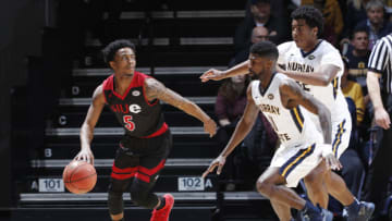 MURRAY, KY - FEBRUARY 09: Shaq Buchanan #11 and Darnell Cowart #32 of the Murray State Racers defend against Tyresse Williford #5 of the SIU-Edwardsville Cougars in the first half of the game at CFSB Center on February 9, 2019 in Murray, Kentucky. Murray State won 86-55. (Photo by Joe Robbins/Getty Images)