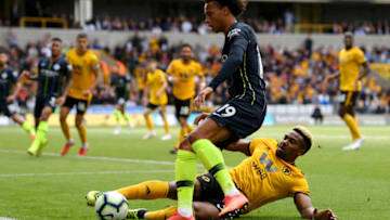 WOLVERHAMPTON, ENGLAND - AUGUST 25: Leroy Sane of Manchester City and Adama Traore of Wolverhampton Wanderers battle for the ball during the Premier League match between Wolverhampton Wanderers and Manchester City at Molineux on August 25, 2018 in Wolverhampton, United Kingdom. (Photo by Stu Forster/Getty Images)