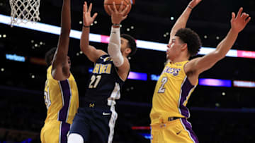 LOS ANGELES, CA - OCTOBER 02: Wilson Chandler #21 of the Denver Nuggets splits the defense of Lonzo Ball #2 and Thomas Bryant #31 of the Los Angeles Lakers during the second half of a preseason game at Staples Center on October 2, 2017 in Los Angeles, California. NOTE TO USER: User expressly acknowledges and agrees that, by downloading and or using this Photograph, user is consenting to the terms and conditions of the Getty Images License Agreement (Photo by Sean M. Haffey/Getty Images)