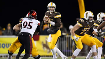 LARAMIE, WY - DECEMBER 03: Josh Allen (17) of the Wyoming Cowboys drops back against the San Diego State Aztecs during the first quarter of play on Saturday, December 3, 2016. The Wyoming Cowboys hosted the San Diego State Aztecs in the Mountain West championship game. (Photo by AAron Ontiveroz/The Denver Post via Getty Images)
