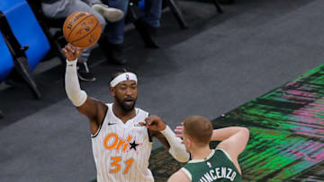 ORLANDO, FL - JANUARY 11: Terrence Ross #31 of the Orlando Magic controls the ball against Donte DiVincenzo #0 of the Milwaukee Bucks at Amway Center on January 11, 2021 in Orlando, Florida. NOTE TO USER: User expressly acknowledges and agrees that, by downloading and or using this photograph, User is consenting to the terms and conditions of the Getty Images License Agreement. (Photo by Alex Menendez/Getty Images)