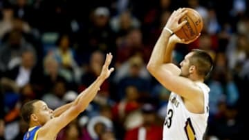Nov 26, 2013; New Orleans, LA, USA; New Orleans Pelicans power forward Ryan Anderson (33) shoots over Golden State Warriors point guard Stephen Curry (30) during the second half of a game at New Orleans Arena. The Warriors defeated the Pelicans 102-101. Mandatory Credit: Derick E. Hingle-USA TODAY Sports