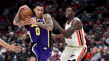 PORTLAND, OREGON - DECEMBER 06: Kyle Kuzma #0 of the Los Angeles Lakers drives to the basket on Nassir Little #9 of the Portland Trail Blazers during the second half of the game at Moda Center on December 06, 2019 in Portland, Oregon. The Lakers won 136-113. NOTE TO USER: User expressly acknowledges and agrees that, by downloading and or using this photograph, User is consenting to the terms and conditions of the Getty Images License Agreement. (Photo by Steve Dykes/Getty Images)