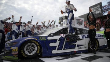 TALLADEGA, ALABAMA - OCTOBER 14: Ryan Blaney, driver of the #12 Dent Wizard Ford, celebrates in Victory Lane after winning the Monster Energy NASCAR Cup Series 1000Bulbs.com 500 at Talladega Superspeedway on October 14, 2019 in Talladega, Alabama. (Photo by Chris Graythen/Getty Images)