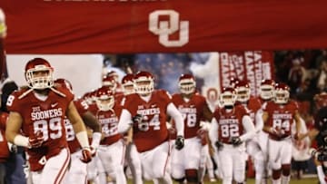 Nov 21, 2015; Norman, OK, USA; Oklahoma Sooners players run onto the field before the game against the TCU Horned Frogs at Gaylord Family - Oklahoma Memorial Stadium. Mandatory Credit: Kevin Jairaj-USA TODAY Sports