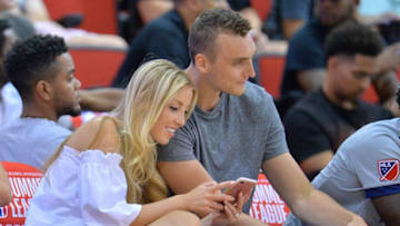 LAS VEGAS, NV - JULY 09: Sam Dekker of the Los Angeles Clippers (R) and fiancee Olivia Harlan, daughter of broadcaster Kevin Harlan, watch a game between the Los Angeles Clippers and Utah Jazz during the 2017 Summer League at the Cox Pavilion on July 9, 2017 in Las Vegas, Nevada. NOTE TO USER: User expressly acknowledges and agrees that, by downloading and or using this photograph, User is consenting to the terms and conditions of the Getty Images License Agreement. (Photo by Sam Wasson/Getty Images)
