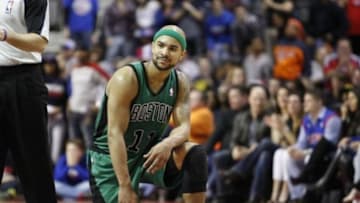 Apr 5, 2014; Auburn Hills, MI, USA; Boston Celtics guard Jerryd Bayless (11) takes a knee after missing a three point shot during the fourth quarter against the Detroit Pistons at The Palace of Auburn Hills. Pistons beat the Celtics 115-111. Mandatory Credit: Raj Mehta-USA TODAY Sports
