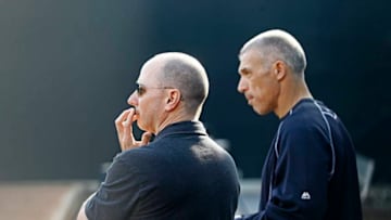 TAMPA, FL - FEBRUARY 26: Yankees general manager Brian Cashman (L) and Manager Joe Girardi (Photo by Brian Blanco/Getty Images)
