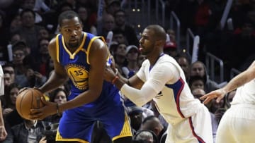 Dec 7, 2016; Los Angeles, CA, USA; Golden State Warriors forward Kevin Durant (35) controls the ball against LA Clippers guard Chris Paul (3) in the third quarter at Staples Center. Mandatory Credit: Richard Mackson-USA TODAY Sports