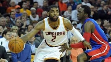 Apr 13, 2015; Cleveland, OH, USA; Cleveland Cavaliers guard Kyrie Irving (2) drives past Detroit Pistons guard Reggie Jackson (1) during the first quarter at Quicken Loans Arena. Mandatory Credit: Ken Blaze-USA TODAY Sports