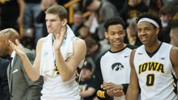 Jan 31, 2016; Iowa City, IA, USA; Iowa Hawkeyes center Adam Woodbury (34) and teammates celebrate from the bench during the second half against the Northwestern Wildcats at Carver-Hawkeye Arena. The Hawkeyes won 85-71. Mandatory Credit: Jeffrey Becker-USA TODAY Sports