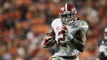 Nov 28, 2015; Auburn, AL, USA; Alabama Crimson Tide running back Derrick Henry (2) races past Auburn Tigers defenders and scores a touchdown in the fourth quarter to beat the Auburn Tigers 29-13 Jordan Hare Stadium. Mandatory Credit: John Reed-USA TODAY Sports