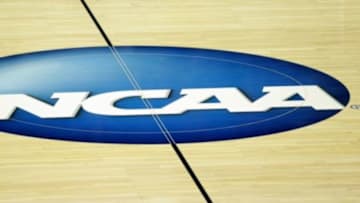 General view of the NCAA logo at BMO Harris Bradley Center before the 2014 NCAA Tournament second round game between the Wisconsin Badgers and the American University Eagles. Mandatory Credit: Jeff Hanisch-USA TODAY Sports