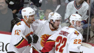 VANCOUVER - APRIL 19: Jarome Iginla (L) #12 of the Calgary Flames celebrates his goal with teammates Matthew Lombardi (C) #8 and Craig Conroy (R) #22 during the game 7 second period of their first round NHL playoff game on April 19, 2004 at General Motors Place in Vancouver, Canada. (Photo by Nick Didlick/Getty Images)