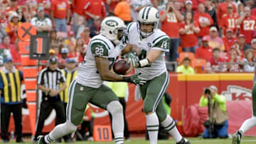Sep 25, 2016; Kansas City, MO, USA; New York Jets quarterback Ryan Fitzpatrick (14) hands off to running back Matt Forte (22) during the second half against the Kansas City Chiefs at Arrowhead Stadium. The Chiefs won 24-3. Mandatory Credit: Denny Medley-USA TODAY Sports