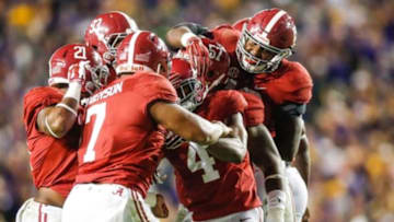Nov 8, 2014; Baton Rouge, LA, USA; Alabama Crimson Tide defensive back Eddie Jackson (4) celebrates with teammates after an interception against the LSU Tigers during the second quarter of a game at Tiger Stadium. Mandatory Credit: Derick E. Hingle-USA TODAY Sports